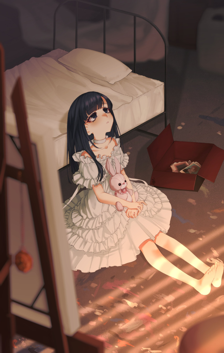 1girl absurdres artoriaswife barefoot bed black_hair blurry blurry_foreground box canvas_(object) choker depth_of_field dress easel frilled_dress frills hands_on_lap highres indoors layered_dress long_hair looking_up on_floor photo_(object) sitting slow_damage solo stuffed_animal stuffed_rabbit stuffed_toy white_choker white_dress yuzuki_mei
