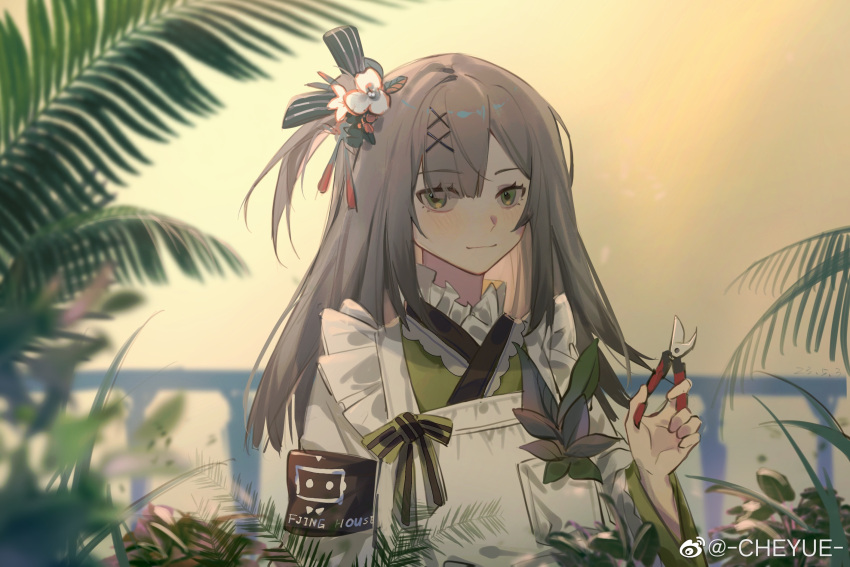 1girl apron armband brown_hair cheyue fern frilled_apron frills girls'_frontline_neural_cloud girls_frontline green_eyes green_kimono hair_ornament highres holding japanese_clothes kimono light_smile long_hair looking_at_viewer outdoors pruning_shears sakuya_(girls'_frontline_nc) solo upper_body weibo_username