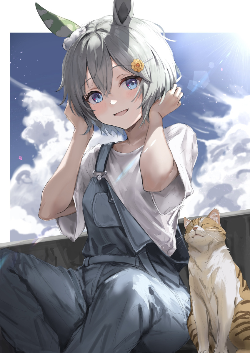 1girl absurdres amanun animal_ears blue_eyes blue_overalls cat ear_covers grey_hair hair_between_eyes hair_ornament hairclip highres horse_ears horse_girl looking_at_viewer official_alternate_costume on_ground open_mouth outdoors overalls seiun_sky_(umamusume) shirt short_hair short_sleeves single_ear_cover smile solo umamusume white_shirt