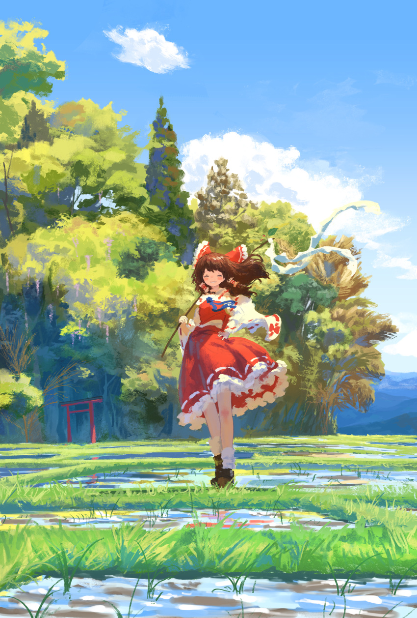 1girl absurdres bare_shoulders black_footwear blush bow brown_hair closed_eyes clouds day detached_sleeves frilled_skirt frills full_body gohei grin hair_bow hair_tubes hakurei_reimu hand_on_own_hip highres holding holding_gohei japanese_clothes kajatony long_hair nontraditional_miko outdoors red_bow red_skirt ribbon-trimmed_sleeves ribbon_trim shoes sidelocks skirt sky smile socks solo torii touhou tree white_sleeves white_socks wide_sleeves