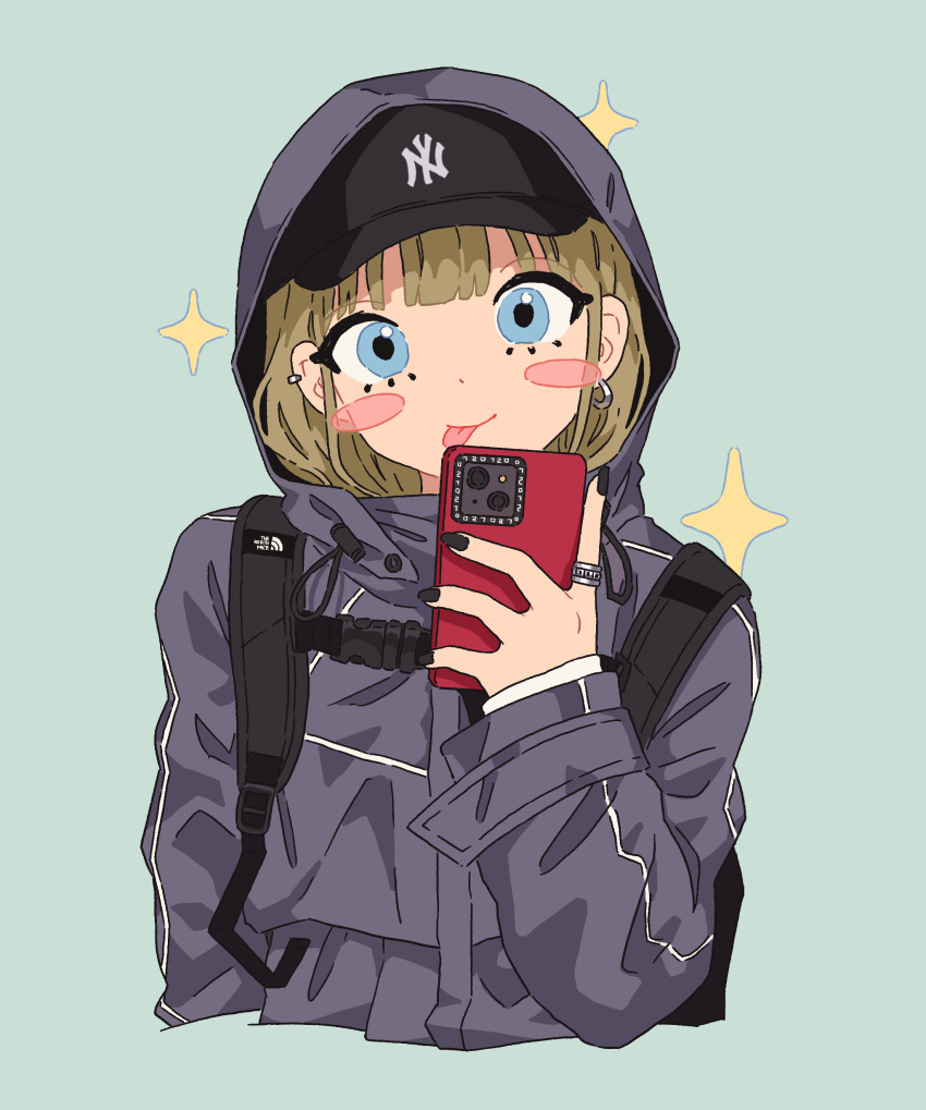 1girl :p absurdres baseball_cap black_headwear black_nails blue_eyes blush blush_stickers brown_hair cellphone cropped_torso earrings green_background grey_jacket guriming hair_behind_ear hat hat_under_hood head_tilt highres holding holding_phone hood hooded_jacket jacket jewelry looking_at_viewer nail_polish new_york_yankees original phone procreate_(medium) ring single_earring smartphone smile solo sparkle the_north_face tongue tongue_out upper_body