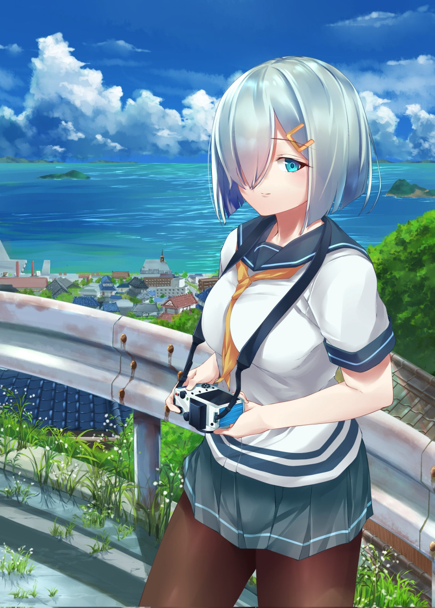 001machi 1girl black_pantyhose blue_eyes blush breasts building camera clouds cloudy_sky cowboy_shot day gloves grey_hair grey_skirt hair_ornament hair_over_one_eye hairclip hamakaze_(kancolle) highres house kantai_collection large_breasts looking_at_viewer mountain neckerchief ocean outdoors pantyhose pleated_skirt road scenery school_uniform serafuku short_hair short_sleeves skirt sky smile solo town white_gloves yellow_neckerchief
