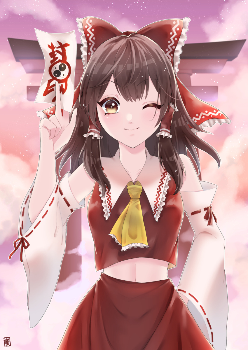 1girl ;) absurdres ascot bow brown_eyes brown_hair clip_studio_paint_(medium) collarbone commentary detached_sleeves ellen_drawing hair_bow hair_tubes hakurei_reimu hand_on_own_hip highres medium_hair ofuda one_eye_closed outdoors red_bow red_shirt ribbon-trimmed_sleeves ribbon_trim shirt sidelocks smile solo torii touhou yellow_ascot