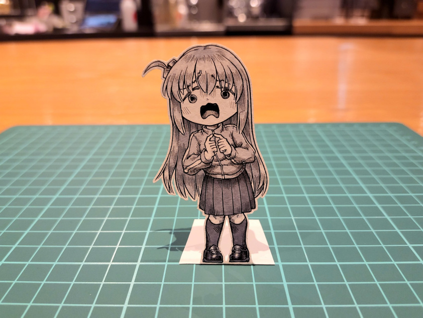 1girl bocchi_the_rock! commentary cube_hair_ornament english_commentary frown gotou_hitori hair_ornament highres index_finger_raised jacket jqhnharqld kneehighs loafers long_hair medium_skirt monochrome one_side_up open_mouth paper_child papercraft_(medium) photo_(medium) pleated_skirt raised_eyebrows shoes skirt socks solo track_jacket unconventional_media wavy_mouth