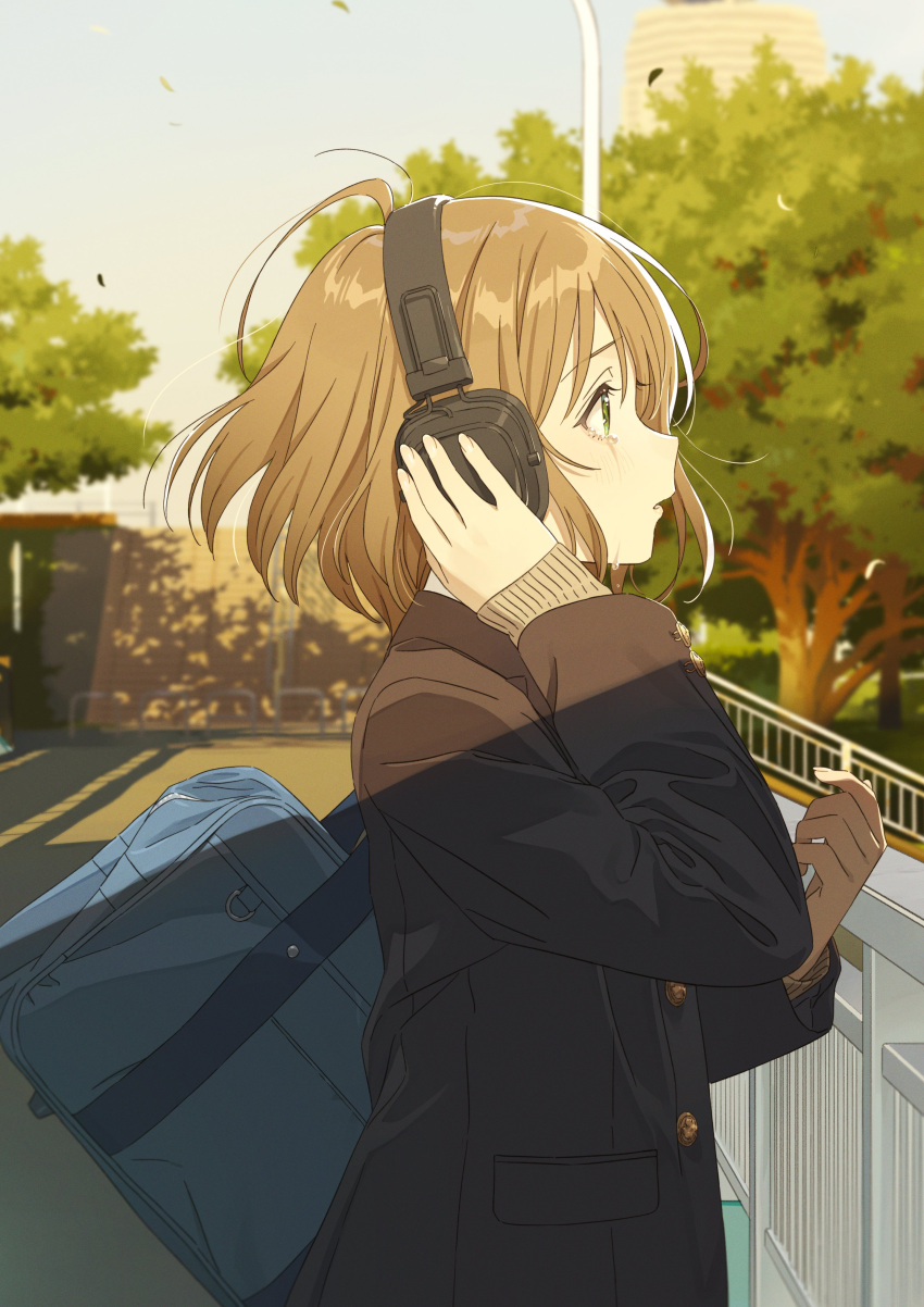 1girl absurdres bag black_coat blue_bag blush brown_hair building cardigan coat crying crying_with_eyes_open dappled_sunlight english_commentary from_side green_eyes hand_on_headphones handrail headphones hechima_(issindotai) highres lamppost looking_to_the_side original school_bag shadow short_hair sidelocks solo streaming_tears sunlight tears tree wistful yellow_cardigan