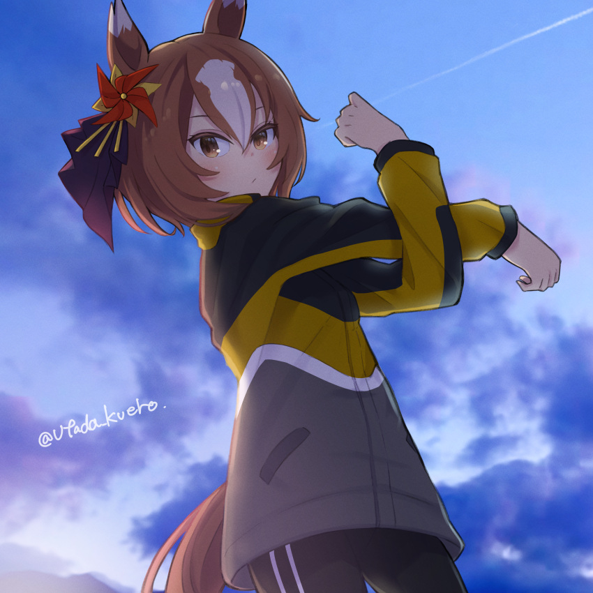 1girl absurdres animal_ears black_pants blue_sky blush brown_eyes brown_hair clouds contrail hair_between_eyes highres horse_ears horse_girl horse_tail jacket long_sleeves looking_at_viewer multicolored_hair open_clothes open_jacket outdoors pants pinwheel_hair_ornament short_hair sky solo streaked_hair stretching sweatpants tail twitter_username two-tone_hair umamusume utada_kuero yaeno_muteki_(umamusume)