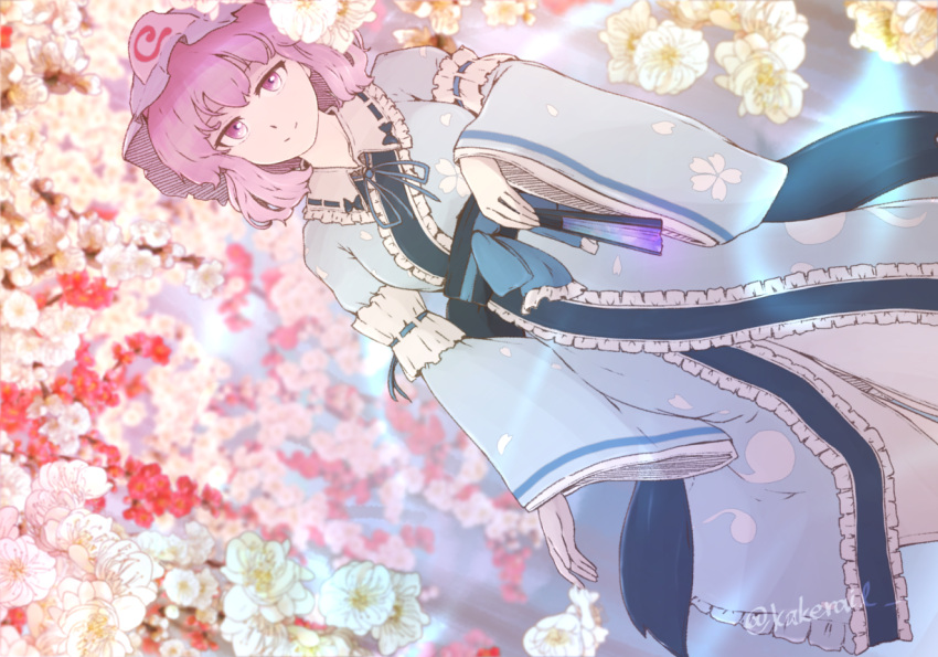 1girl blue_headwear blue_kimono blurry closed_mouth commentary depth_of_field dutch_angle flower frilled_kimono frills hat japanese_clothes kakera_(comona_base) kimono looking_at_viewer mob_cap outdoors pink_eyes pink_hair saigyouji_yuyuko short_hair smile solo touhou triangle_mouth twitter_username white_flower