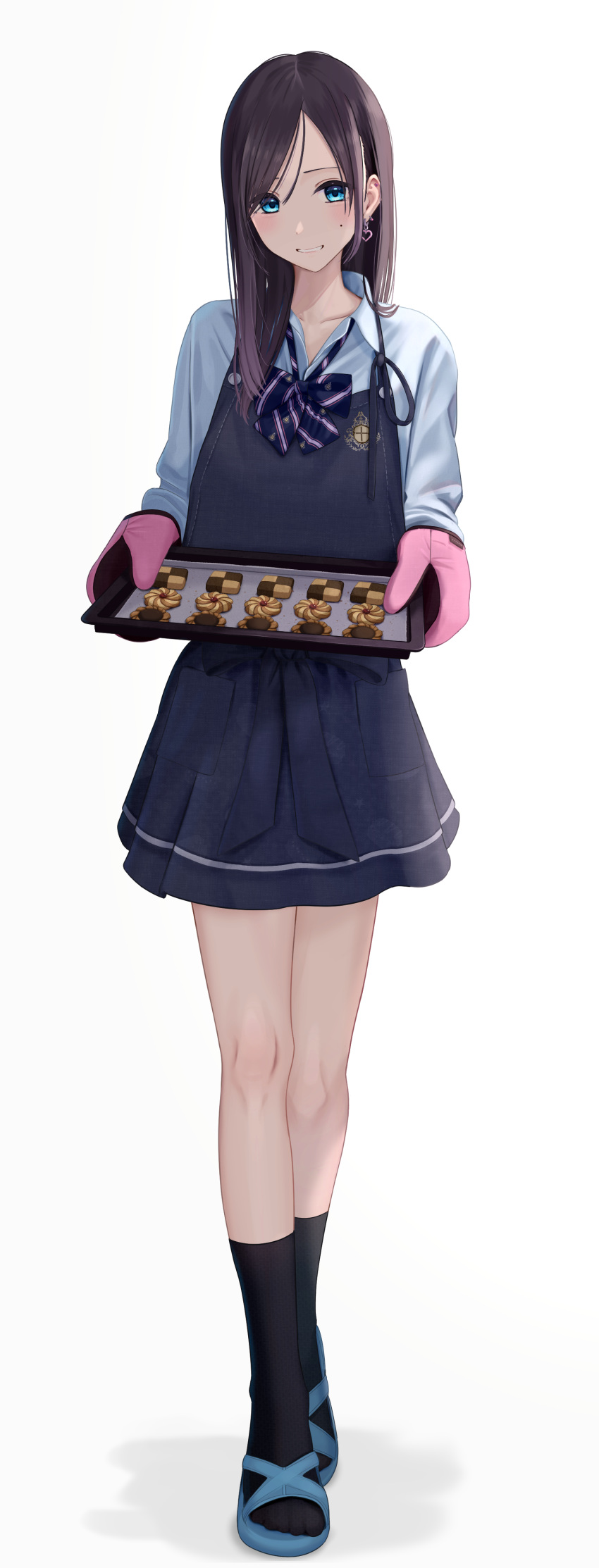 1girl absurdres apron baking_sheet black_socks blue_apron blue_eyes blue_footwear blue_shirt blush bow collarbone collared_shirt cookie earrings food full_body grin heart heart_earrings highres holding inaka_44 jewelry long_hair looking_at_viewer mole mole_under_eye original oven_mitts pink_mittens shadow shirt simple_background smile socks solo striped striped_bow white_background