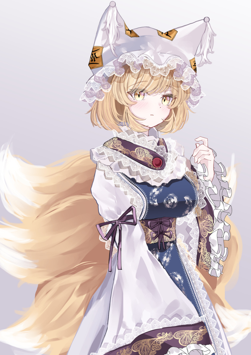 1girl :3 animal_ears animal_hat blonde_hair blue_tabard closed_mouth commentary_request cowboy_shot dress fox_ears fox_tail frilled_sleeves frills hand_up hat highres lace-trimmed_headwear lace_trim long_sleeves looking_at_viewer multiple_tails sarasadou_dan short_hair solo tabard tail touhou white_dress wide_sleeves yakumo_ran yellow_eyes