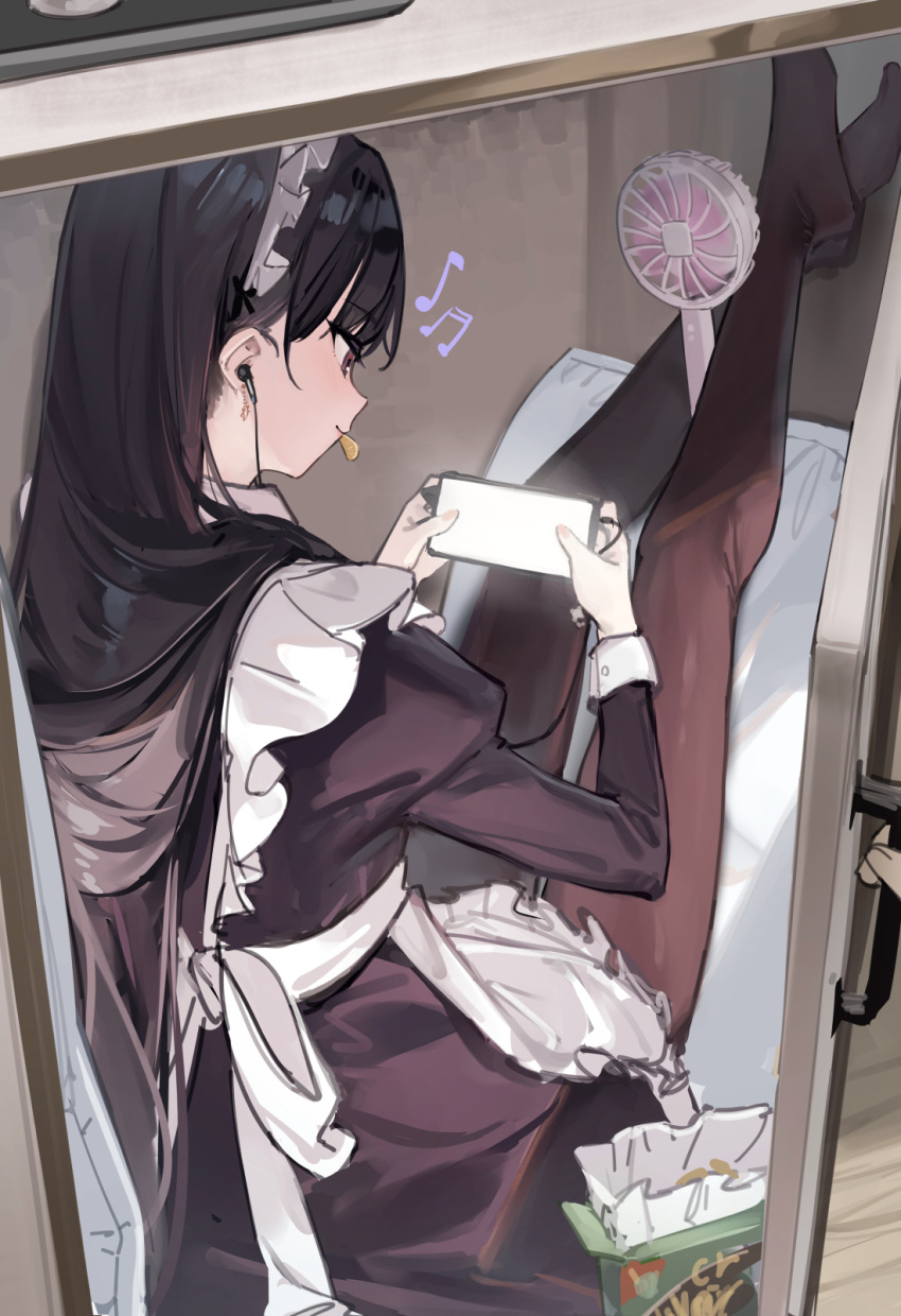 1girl 7gao apron beamed_eighth_notes black_dress black_hair black_pantyhose cabinet cellphone chips_(food) dress earphones earphones eighth_note food from_behind handheld_fan highres holding holding_phone juliet_sleeves legs_up long_bangs long_hair long_sleeves maid maid_headdress mouth_hold musical_note no_shoes original pantyhose phone pillow playing_games potato_chips puffy_sleeves red_eyes sidelocks smartphone solo white_apron