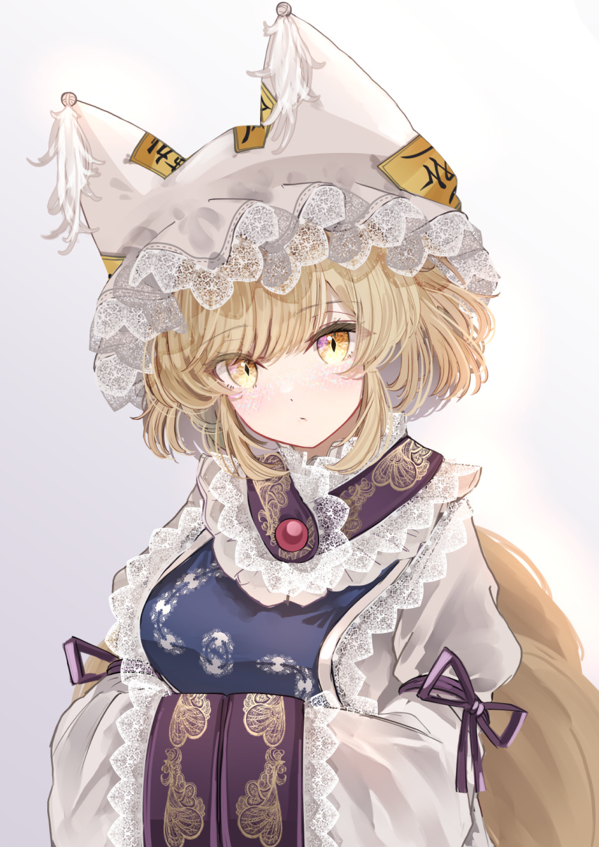 1girl animal_ears blonde_hair blush closed_mouth dress fox_ears fox_tail gradient_background hands_in_opposite_sleeves hat highres looking_at_viewer mob_cap multiple_tails sarasadou_dan short_hair sleeves_past_fingers sleeves_past_wrists solo tabard tail touhou white_dress white_headwear wide_sleeves yakumo_ran yellow_eyes