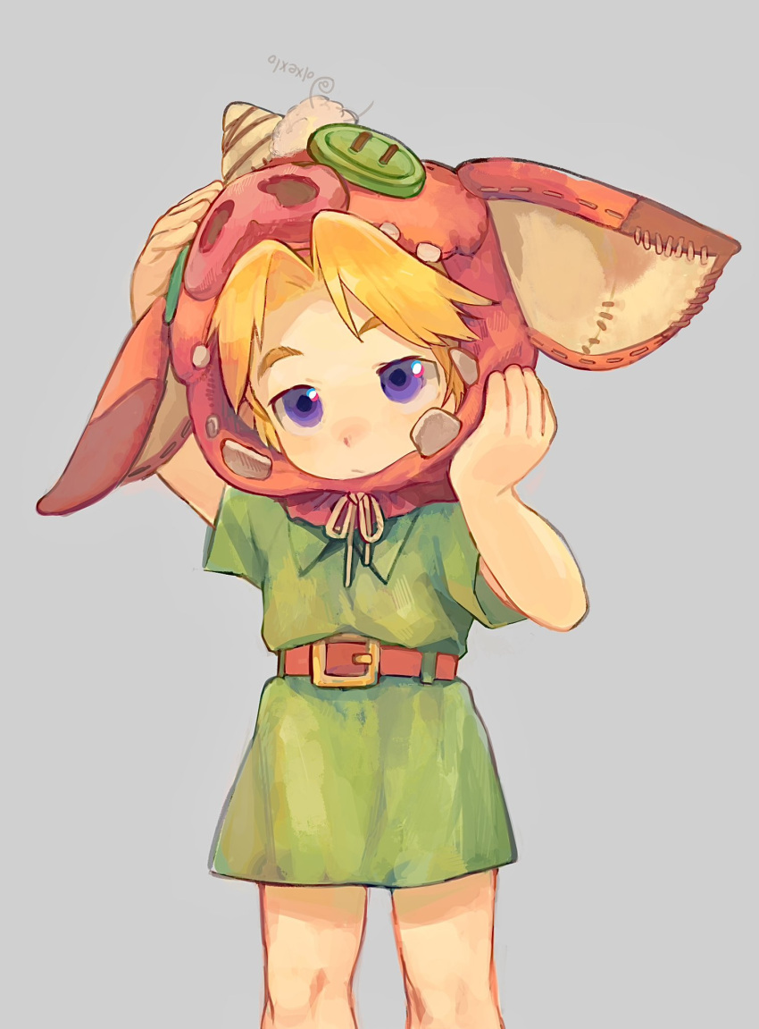 1boy animal_hat belt blonde_hair child closed_mouth cowboy_shot facing_viewer green_tunic grey_background hands_on_headwear hat highres link male_child male_focus olxexlo pig_hat short_hair simple_background solo the_legend_of_zelda tunic young_link