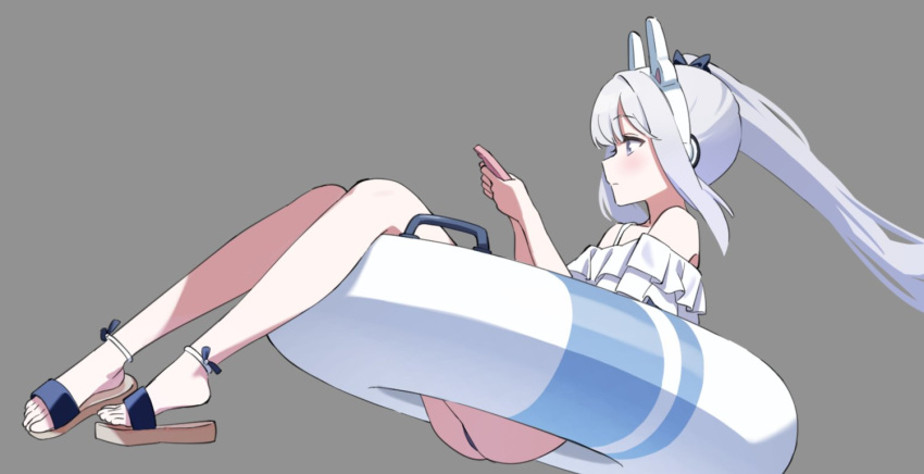1girl animal_ear_headphones animal_ears ass bare_shoulders blue_archive commentary_request fake_animal_ears feet frilled_one-piece_swimsuit frills from_side grey_background headphones legs long_hair miyako_(swimsuit)_(blue_archive) off-shoulder_one-piece_swimsuit off_shoulder on_innertube one-piece_swimsuit ponytail rabbit_ear_headphones sandals sanzoku solo swimsuit toes violet_eyes white_hair white_innertube