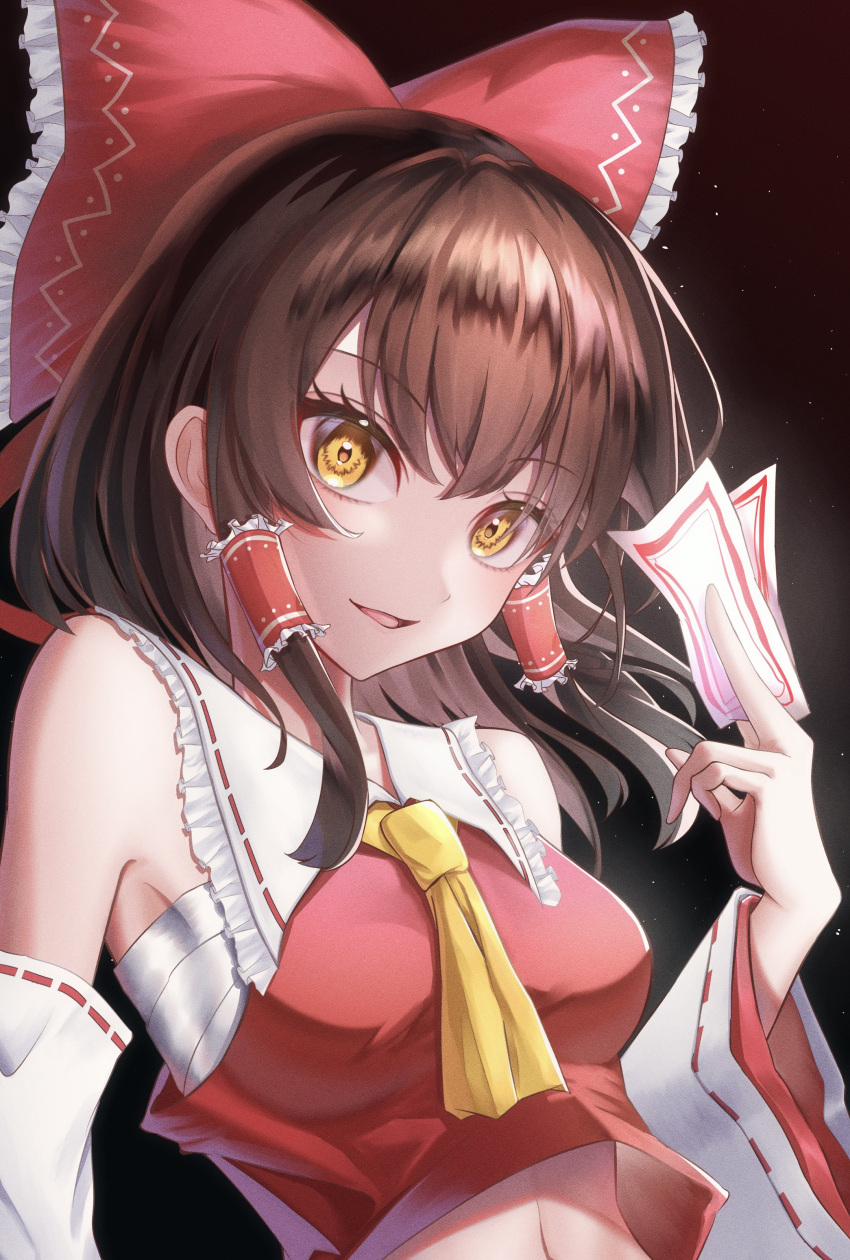 1girl :d absurdres armpits ascot between_fingers bloom bow brown_background brown_eyes brown_hair commentary_request dark_background frilled_shirt_collar frills hair_bow hair_tubes hakurei_reimu hand_up highres holding kitsutsuki_tsuki light_particles looking_at_viewer midriff navel ofuda outer_glow parted_lips red_bow red_vest sarashi simple_background smile solo touhou upper_body vest yellow_ascot yellow_eyes