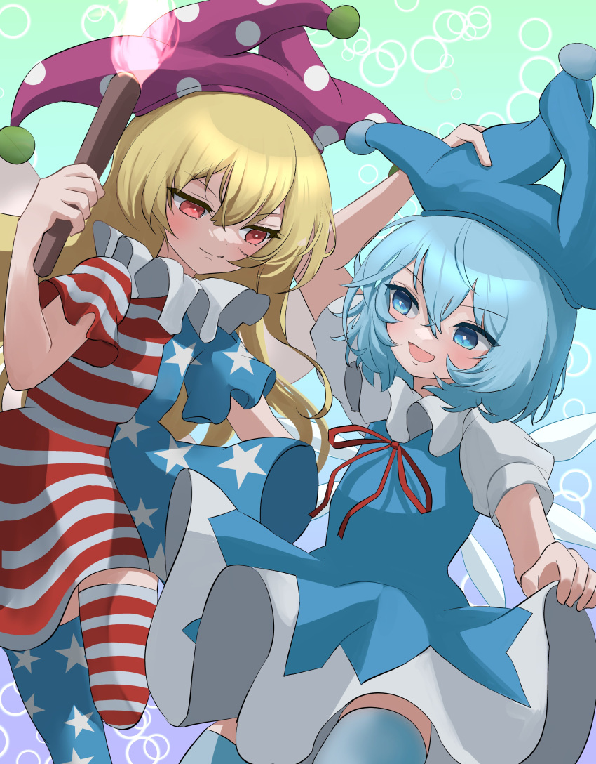 2girls :d absurdres american_flag_dress american_flag_legwear blonde_hair blue_background blue_dress blue_hair blue_headwear blue_thighhighs cirno closed_mouth clownpiece commentary dress gradient_background green_background hand_on_headwear hat highres holding holding_torch jester_cap long_hair looking_at_another mikan_(manmarumikan) multicolored_clothes multiple_girls open_mouth polka_dot_headwear purple_headwear red_eyes smile star_(symbol) star_print striped striped_dress striped_thighhighs thigh-highs torch touhou