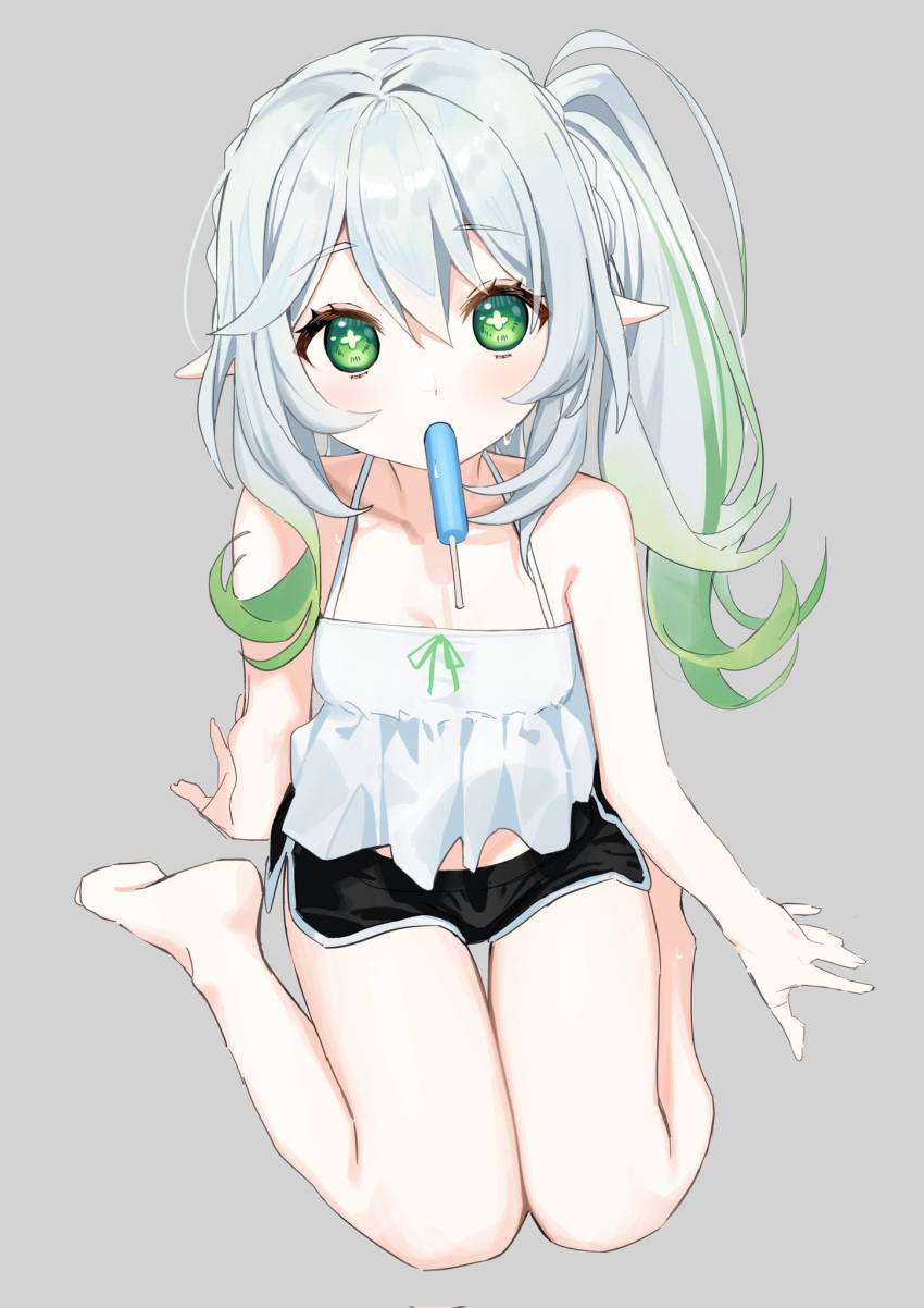 1girl arm_support bare_legs bare_shoulders barefoot braid camisole cross-shaped_pupils dolphin_shorts flat_chest food food_in_mouth frilled_camisole frills genshin_impact gradient_hair green_eyes green_hair grey_background hair_between_eyes highres long_hair looking_at_viewer multicolored_hair nahida_(genshin_impact) pointy_ears popsicle popsicle_in_mouth seiza shorts side_braid side_ponytail sidelocks sitting syhan symbol-shaped_pupils white_hair