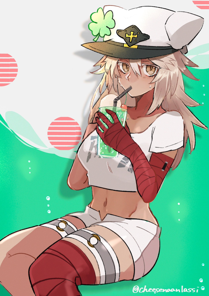 1girl artist_name bandaged_arm bandages blonde_hair breasts cape cheesenaanlassi clover dark-skinned_female dark_skin drink drinking drinking_straw four-leaf_clover guilty_gear guilty_gear_strive guilty_gear_xrd hair_between_eyes hat highres holding holding_drink long_hair looking_at_viewer medium_breasts navel orange_eyes ramlethal_valentine red_bandage short_shorts shorts solo thigh_strap white_shorts yellow_eyes