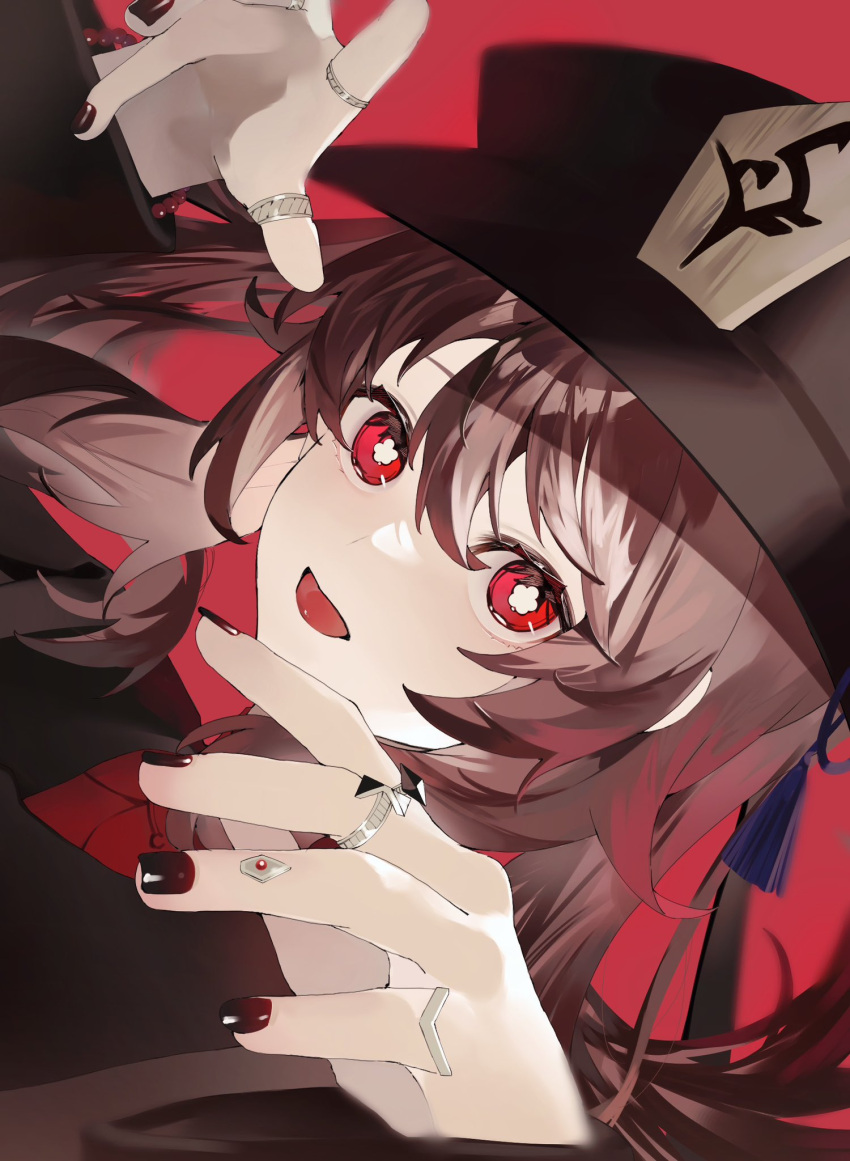 1girl black_nails brown_hair chinese_clothes dekitateomoti flower-shaped_pupils genshin_impact hat hat_ornament highres hu_tao_(genshin_impact) jewelry long_sleeves looking_at_viewer open_mouth porkpie_hat red_eyes red_shirt ring shirt sidelocks simple_background symbol-shaped_pupils