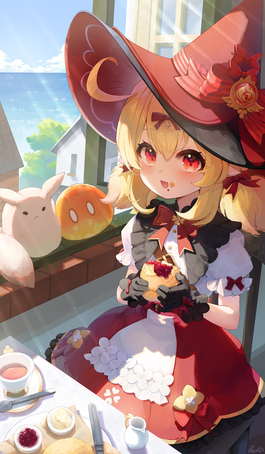 1girl black_gloves blonde_hair blush cup food food_on_face genshin_impact gloves hat highres holding holding_food klee_(blossoming_starlight)_(genshin_impact) klee_(genshin_impact) looking_at_viewer official_alternate_costume pistachiocream puffy_short_sleeves puffy_sleeves red_headwear short_sleeves spoon teacup witch_hat