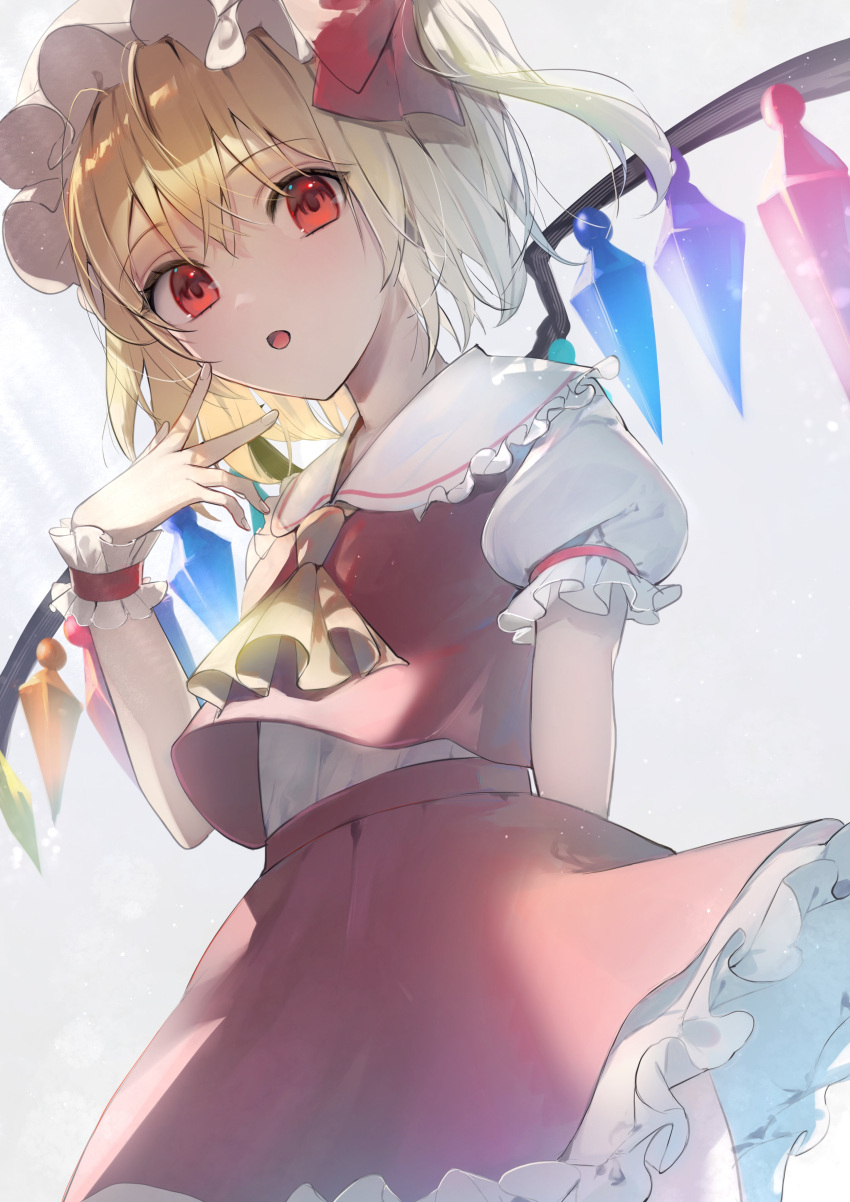 1girl absurdres arm_behind_back ascot backlighting blonde_hair bloom commentary_request crystal flandre_scarlet flat_chest grey_background hand_up hat highres kamatoyu mob_cap overexposure red_skirt red_vest short_hair simple_background skirt skirt_set solo touhou v vest white_background wings yellow_ascot