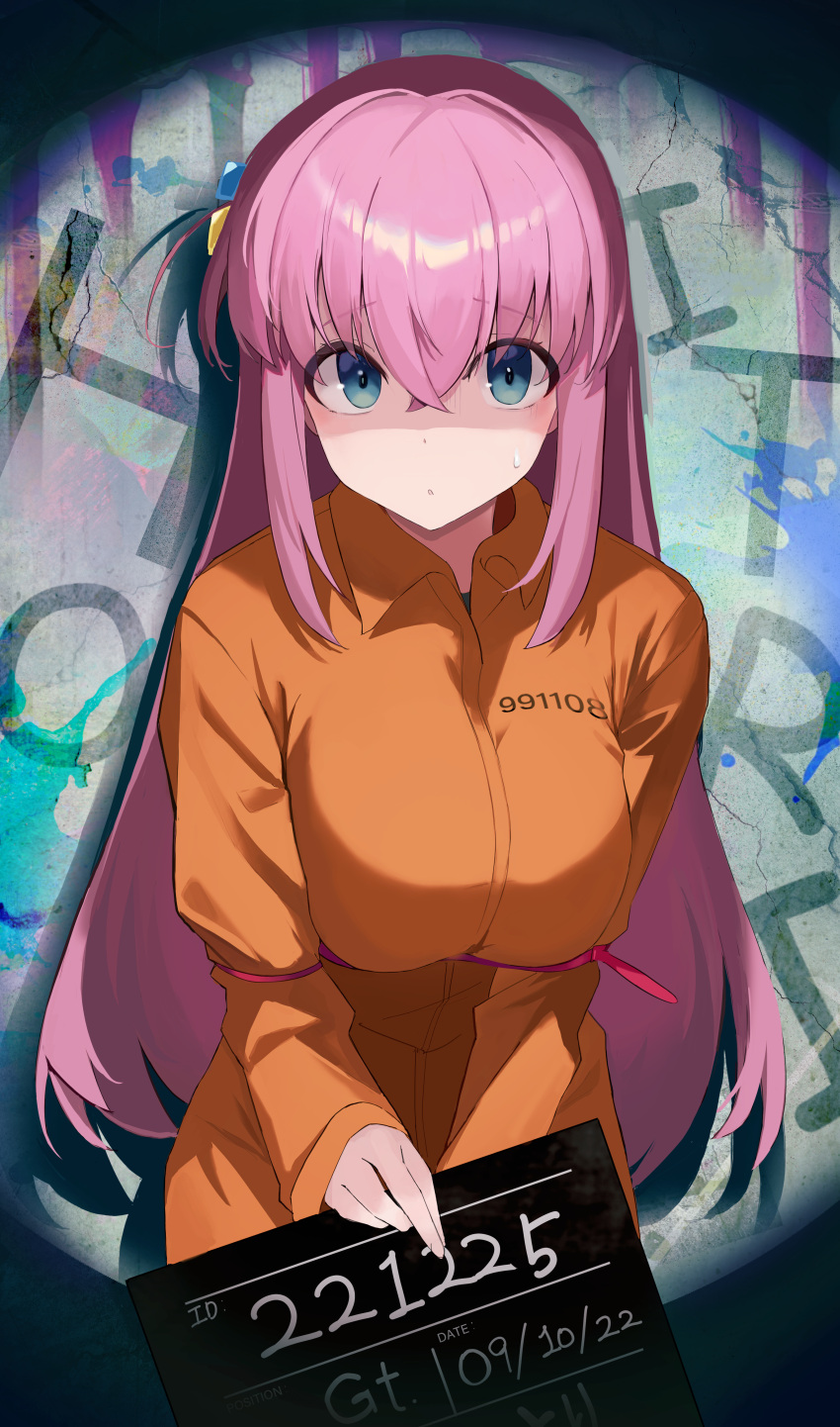 1girl absurdres alternate_costume blue_eyes bocchi_the_rock! bound bound_arms breasts crossed_bangs cube_hair_ornament gotoh_hitori graffiti hair_ornament highres holding holding_sign jumpsuit large_breasts long_hair looking_at_viewer mugshot n8_(buse1601) orange_jumpsuit pink_hair prison_clothes side_ahoge sign solo sweatdrop very_long_hair