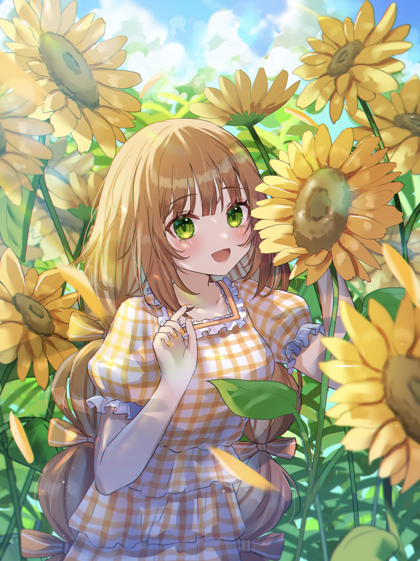 1girl absurdres blush bow brown_hair day dress field flower flower_field frilled_shirt_collar frilled_sleeves frills gingham_dress green_eyes hair_bow highres looking_at_viewer low_twintails multi-tied_hair nail_polish open_mouth original outdoors plaid plaid_dress shinzousan short_sleeves smile solo sunflower sunflower_field twintails upper_body