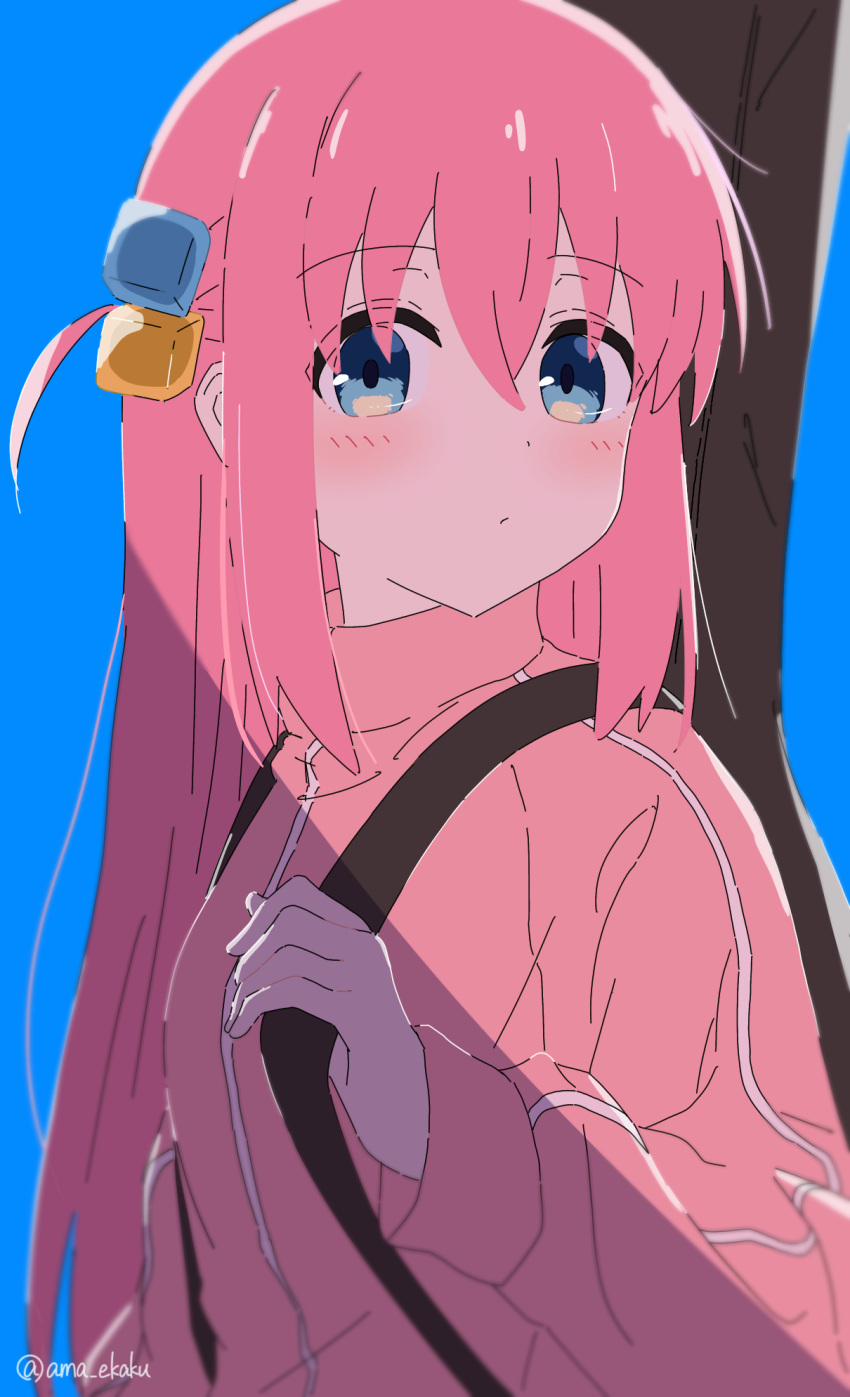 1girl ama_(ama_ekaku) artist_name backpack bag blue_background blue_eyes blush bocchi_the_rock! commentary_request cube_hair_ornament gotoh_hitori guitar_case hair_ornament highres instrument_case jacket long_hair looking_at_viewer pink_hair pink_jacket simple_background solo track_jacket upper_body