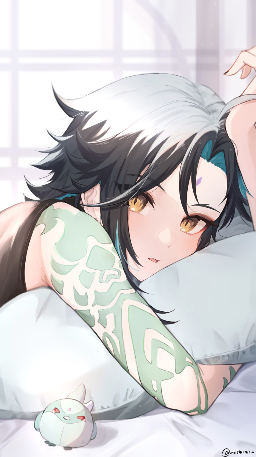 1boy absurdres arm_tattoo black_hair black_nails black_shirt blue_hair blush facial_mark forehead_mark genshin_impact highres hugging_object looking_at_viewer lying male_focus mashiraion multicolored_hair on_stomach parted_lips pillow pillow_hug shirt sleeveless sleeveless_shirt solo stuffed_animal stuffed_bird stuffed_toy tattoo twitter_username upper_body xiao_(genshin_impact) yellow_eyes