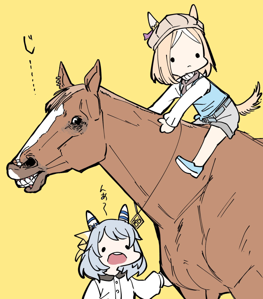 2girls aged_down animal_ears belt blonde_hair blue_eyes brown_headwear cabbie_hat casual commentary ear_covers ear_ornament ear_piercing ears_through_headwear glaring grey_hair grey_shorts hat highres hishi_miracle_(umamusume) horse horse_ears horse_girl horse_tail horseback_riding jewelry long_sleeves multicolored_hair multiple_girls narita_top_road_(umamusume) official_alternate_costume open_mouth parted_bangs pendant piercing real_life riding sanpaku shorts sideways_glance single_ear_cover soccer_boy_(racehorse) solid_circle_eyes streaked_hair tail takatsuki_nato teeth translated two-tone_hair umamusume upper_teeth_only white_hair yellow_background