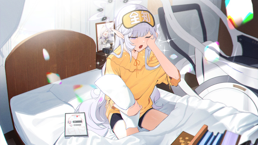 1girl ;o absurdres alternate_costume bed_frame bed_sheet black_shorts blanket blue_archive blush book dolphin_shorts grey_hair halo highres himari_(blue_archive) indoors on_bed one_eye_closed photo_(object) picture_frame pillow pointy_ears shirt shorts sleepy solo tablet_pc tears violet_eyes waking_up wheelchair yellow_shirt zanya_000