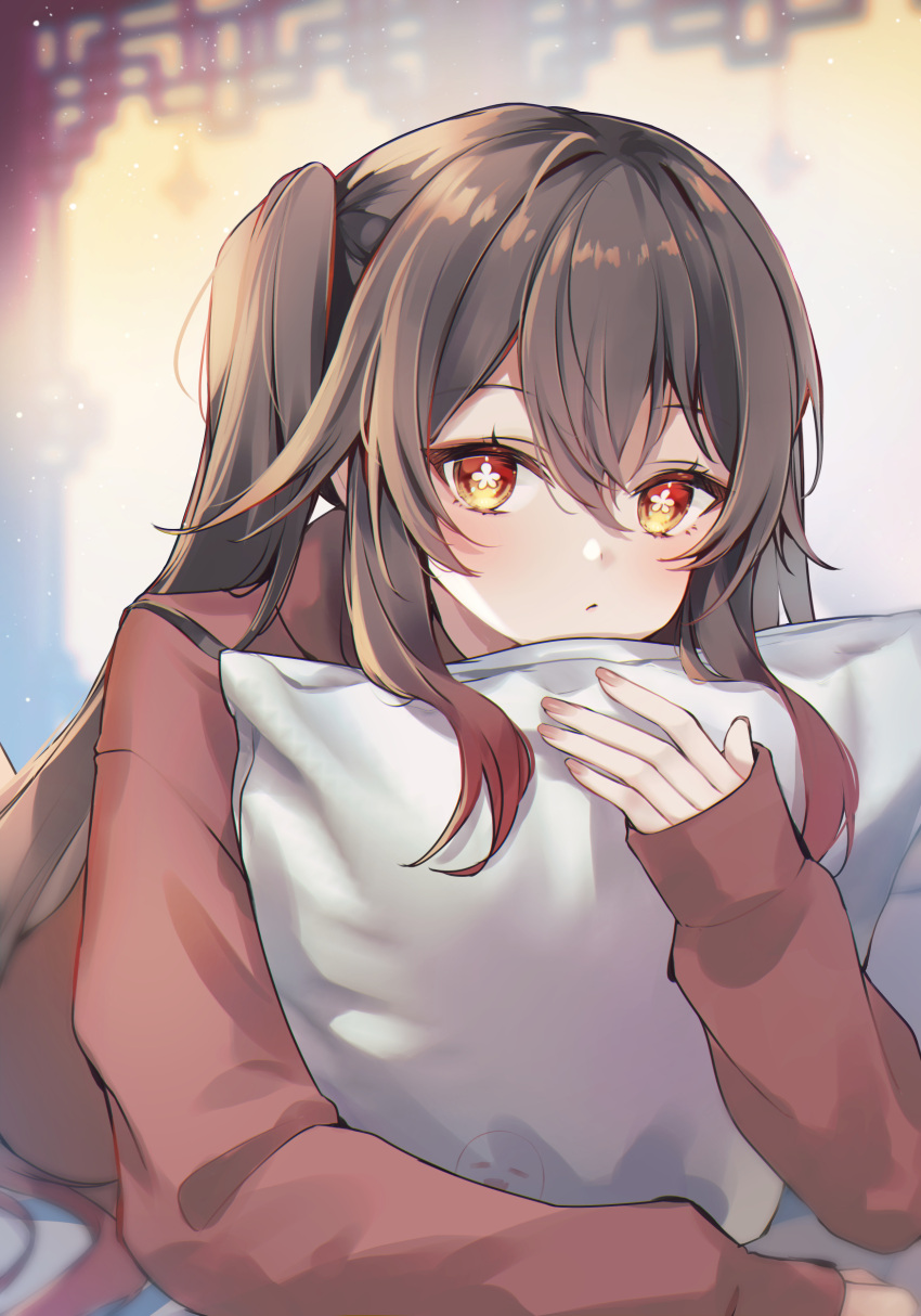 1girl 7aka_ne11 absurdres boo_tao_(genshin_impact) brown_hair closed_mouth colored_tips flower-shaped_pupils genshin_impact highres holding holding_pillow hu_tao_(genshin_impact) long_hair long_sleeves looking_at_viewer multicolored_hair on_bed pillow red_eyes red_shirt redhead shirt solo symbol-shaped_pupils twintails upper_body