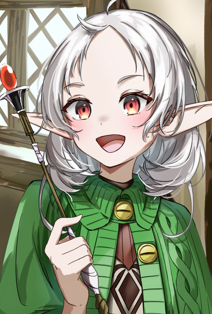 1girl :d ahoge capelet elf green_capelet highres holding holding_wand indoors medium_hair mushoku_tensei open_mouth pointy_ears red_eyes smile solo sturgeon_0521 sylphiette_(mushoku_tensei) wand white_hair