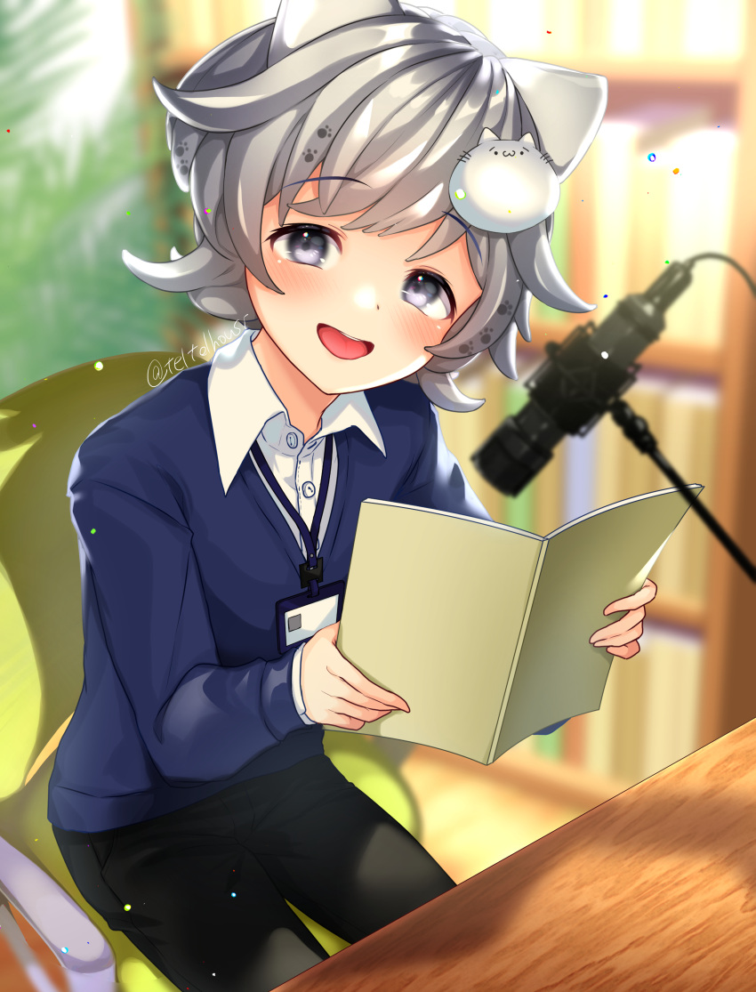 1boy absurdres black_pants blue_sweater blurry blurry_background book cat_boy cat_hair_ornament collared_shirt grey_eyes grey_hair hair_ornament highres holding holding_book indie_virtual_youtuber kasuya_mofu microphone on_chair open_mouth pants paw_print shirt short_hair sitting solo sweater table teltelhousi twitter_username virtual_youtuber white_shirt