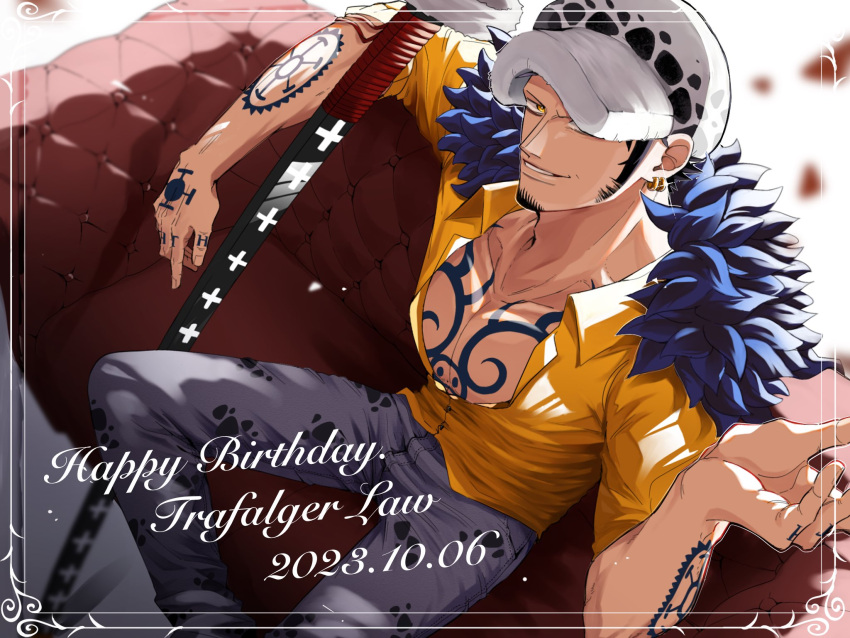 1boy arm_tattoo black_hair chest_tattoo coat coat_on_shoulders denim facial_hair from_above fur-trimmed_coat fur_trim grin hamu_ha_umai hand_tattoo hand_up happy_birthday hat hat_over_one_eye highres jeans long_sideburns male_focus one_eye_covered one_piece pants partially_unbuttoned sheath sheathed shirt sideburns sitting sleeves_rolled_up smile solo tattoo trafalgar_law yellow_eyes yellow_shirt