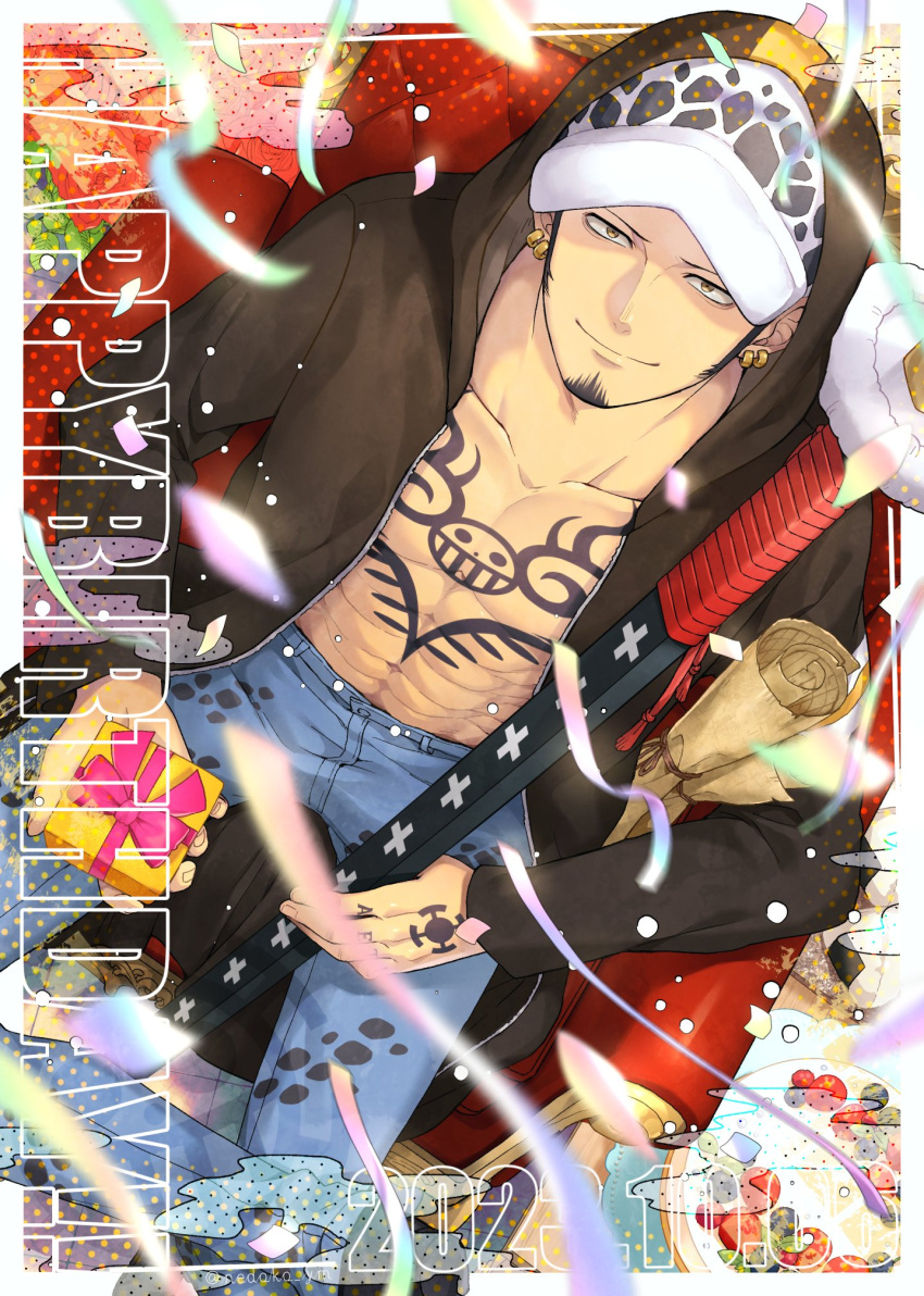 1boy black_coat black_hair cake chest_tattoo coat confetti couch denim earrings facial_hair food from_above gift hand_tattoo happy_birthday hat highres holding holding_gift holding_sheath hood hood_up jeans jewelry male_focus nedoko_ym one_piece open_clothes open_coat pants shade sheath sheathed smile solo tattoo trafalgar_law yellow_eyes