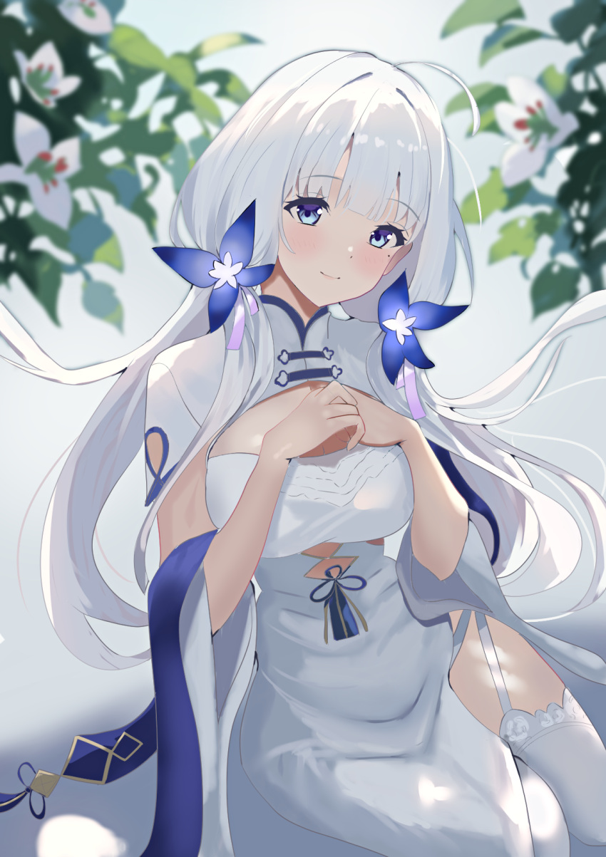 azur_lane blue_hair china_dress chinese_clothes cleavage_cutout clothing_cutout commentary_request cutout_above_navel dress duosix_setsu0408 flower garter_straps hair_flower hair_ornament hands_on_own_chest highres illustrious_(azur_lane) illustrious_(maiden_lily's_radiance)_(azur_lane) long_hair mole mole_under_eye official_alternate_costume own_hands_together pelvic_curtain side_slit thigh-highs tri_tails white_dress white_garter_straps white_hair white_thighhighs