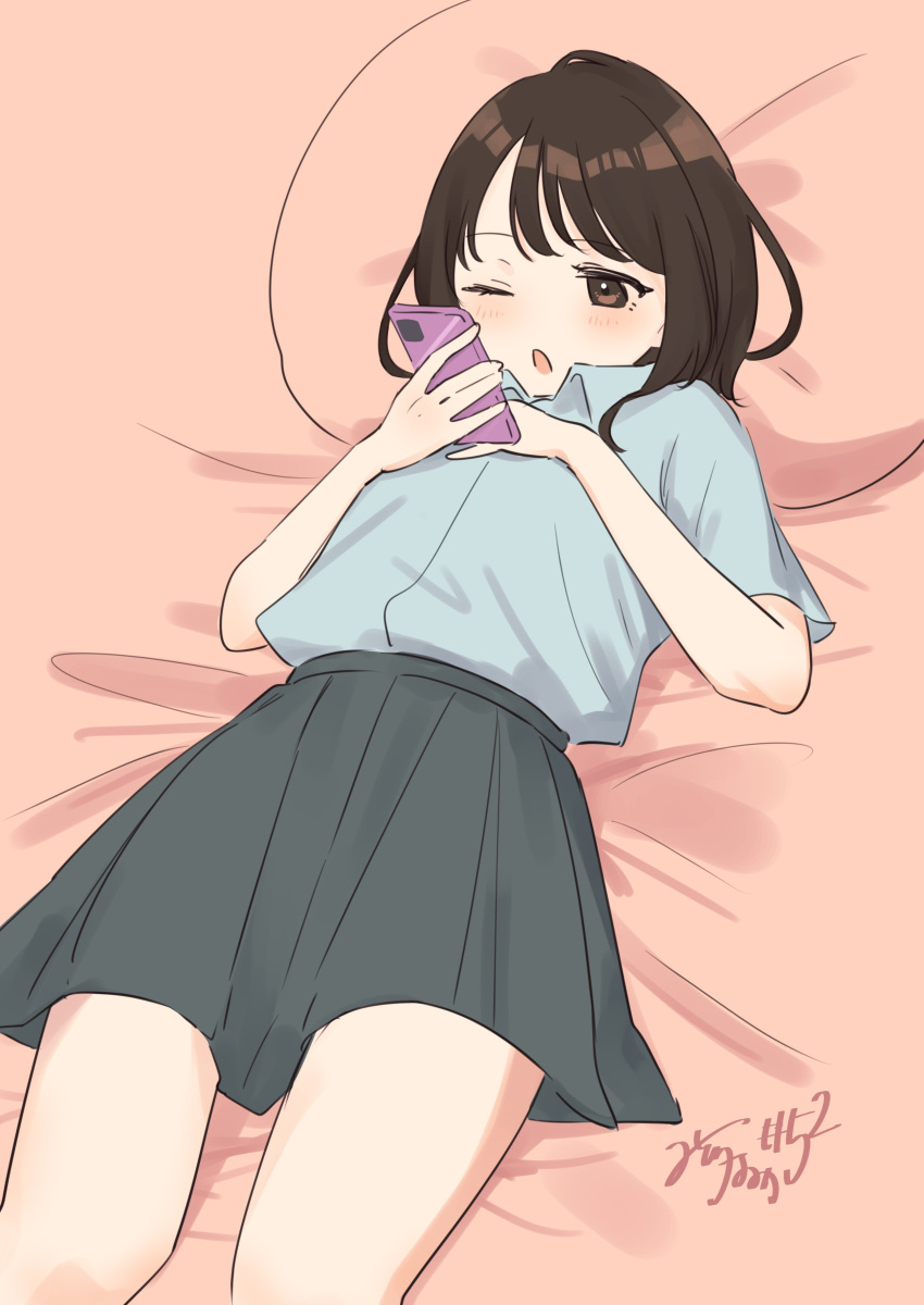 1girl :o absurdres black_hair blush brown_eyes feet_out_of_frame grey_shirt grey_skirt highres holding holding_phone looking_at_object lying mitora_nao on_back one_eye_closed open_mouth original phone pillow pleated_skirt school_uniform shirt shirt_tucked_in short_hair short_sleeves skirt solo thighs