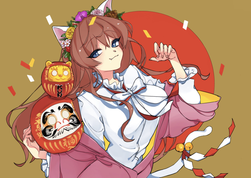 1girl animal_ears bell blue_eyes bow breasts brown_background brown_hair cat_ears cat_tail confetti daruma_doll fang hand_up head_wreath highres long_hair medium_breasts noi_noi_99 original red_ribbon ribbon shirt solo tail tail_bell tail_ornament white_bow white_shirt