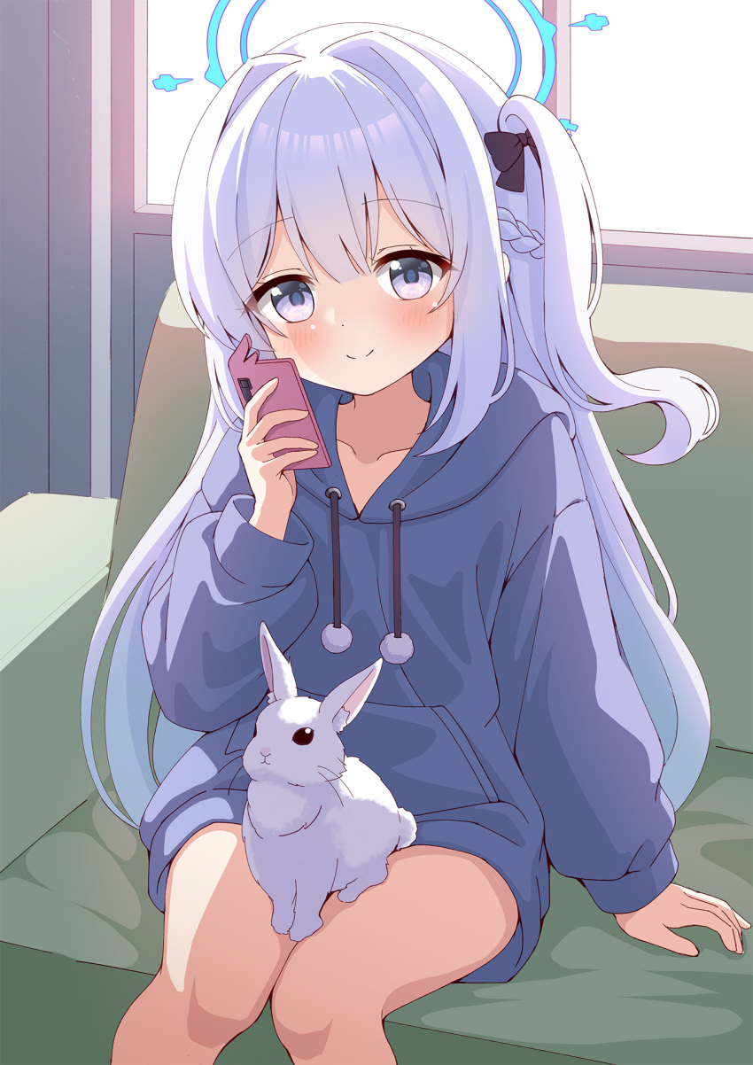 1girl animal azel_(laevateinn495) black_bow blue_archive blue_halo blue_hoodie blush bow braid cellphone closed_mouth collarbone commentary_request couch drawstring feet_out_of_frame french_braid hair_bow halo highres holding holding_phone hood hood_down hoodie indoors long_hair long_sleeves looking_at_viewer miyako_(blue_archive) on_couch one_side_up phone pom_pom_(clothes) puffy_long_sleeves puffy_sleeves purple_hair rabbit sitting smartphone smartphone_case smile solo split_mouth violet_eyes