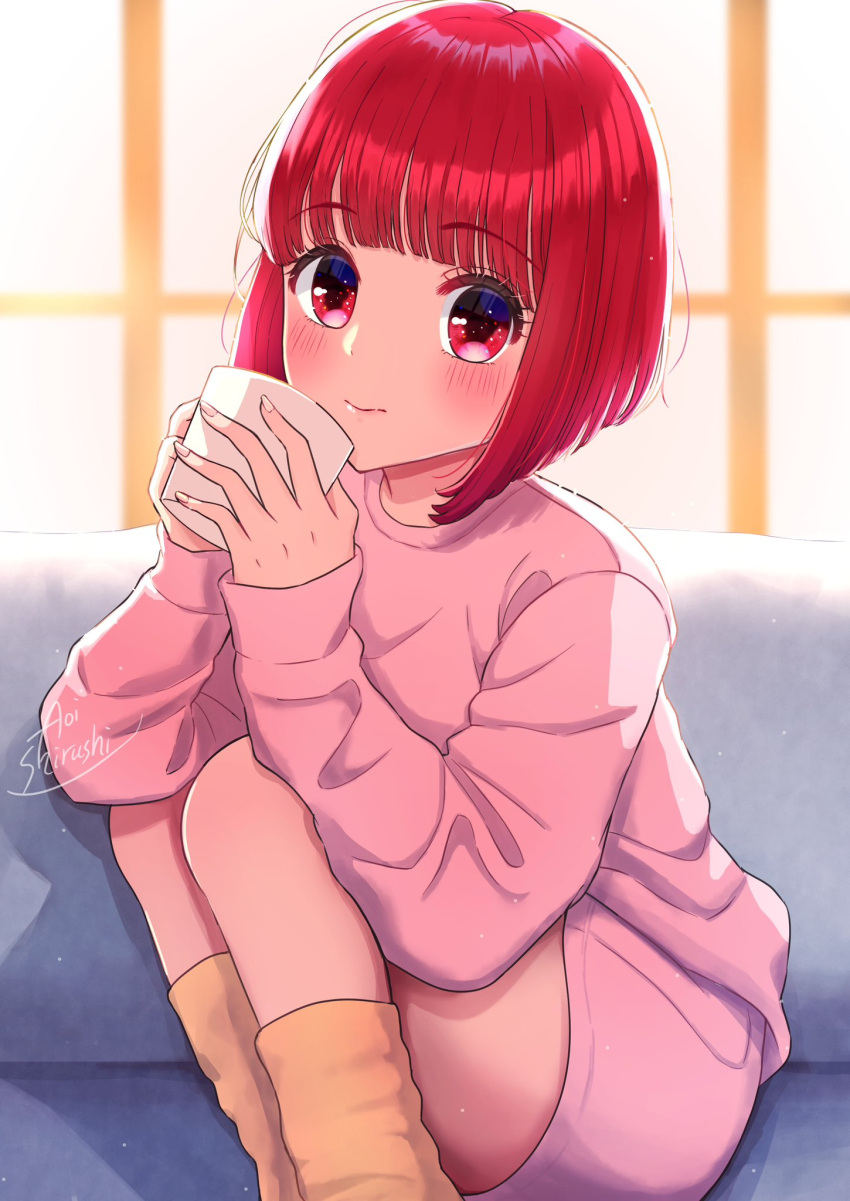 1girl arima_kana bob_cut closed_mouth couch cup highres holding holding_cup light_blush light_smile looking_at_viewer on_couch oshi_no_ko pants pink_pants pink_shirt red_eyes redhead shirt shirushi_aoi short_hair socks solo window