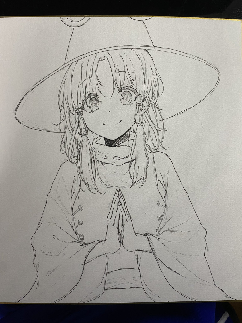 1girl closed_mouth commentary_request greyscale hat hegata_(hegatia_lapis) highres long_sleeves looking_at_viewer medium_hair monochrome moriya_suwako no_color own_hands_together parted_bangs sidelocks smile solo touhou traditional_media upper_body wide_sleeves