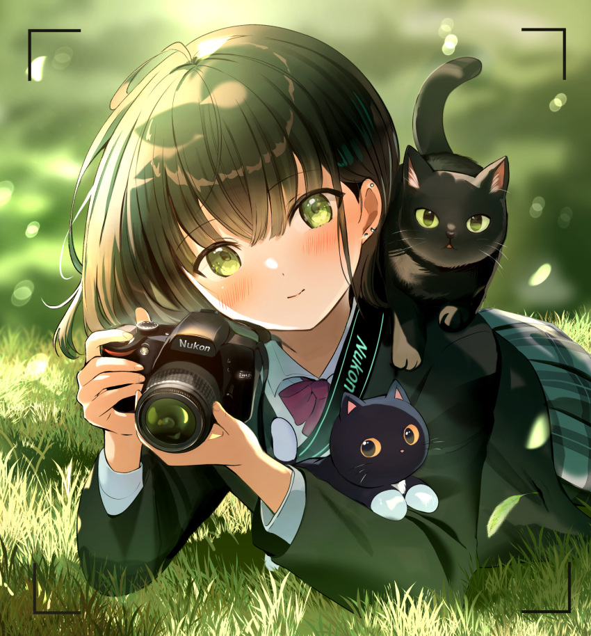 1girl rnschool_uniform black_cat bow bowtie camera cat ear_piercing earrings green_eyes green_hair green_jacket highres holding holding_camera jacket jewelry looking_at_viewer lying on_grass on_stomach original piercing pleated_skirt red_bow red_bowtie single-lens_reflex_camera skirt smile solo tasuku_(otomebotan) viewfinder white_shirt