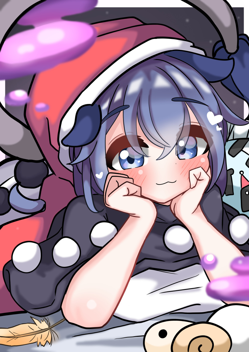 1girl :3 absurdres black_capelet blue_eyes blue_hair blush capelet closed_mouth commentary_request doremy_sweet eyes_visible_through_hair feathers hands_on_own_cheeks hands_on_own_face hat heart highres kkfri_2525 lying on_bed on_stomach red_headwear shirt short_hair solo touhou white_shirt