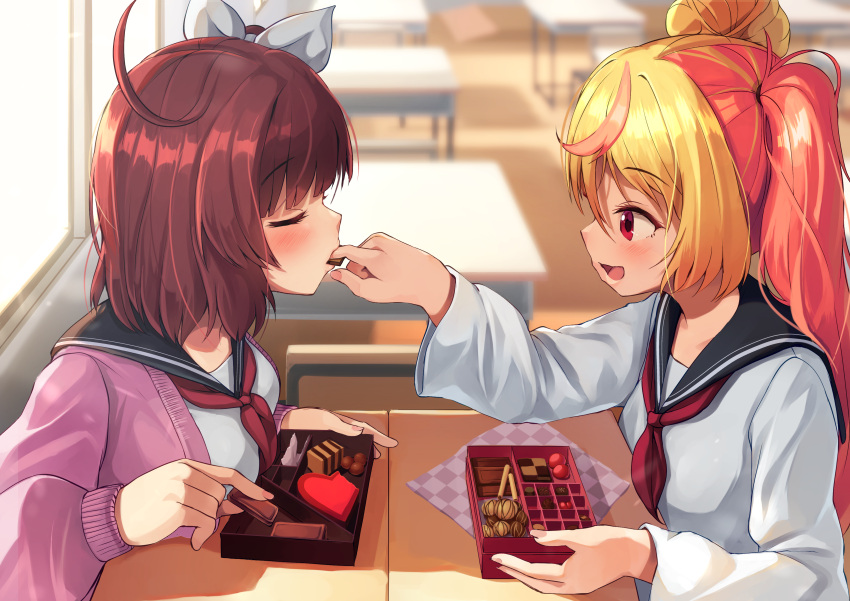 2girls absurdres ahoge black_sailor_collar blonde_hair blush bow breasts candy cardigan chocolate classroom closed_eyes desk feeding finger_in_another's_mouth food hair_bow heart heart-shaped_chocolate highres large_breasts looking_at_another medium_hair multicolored_hair multiple_girls original pink_hair ponytail purple_cardigan red_eyes redhead sailor_collar school_desk school_uniform shared_food shirt smile uniform valentine wanashi_tam white_bow white_shirt yuri