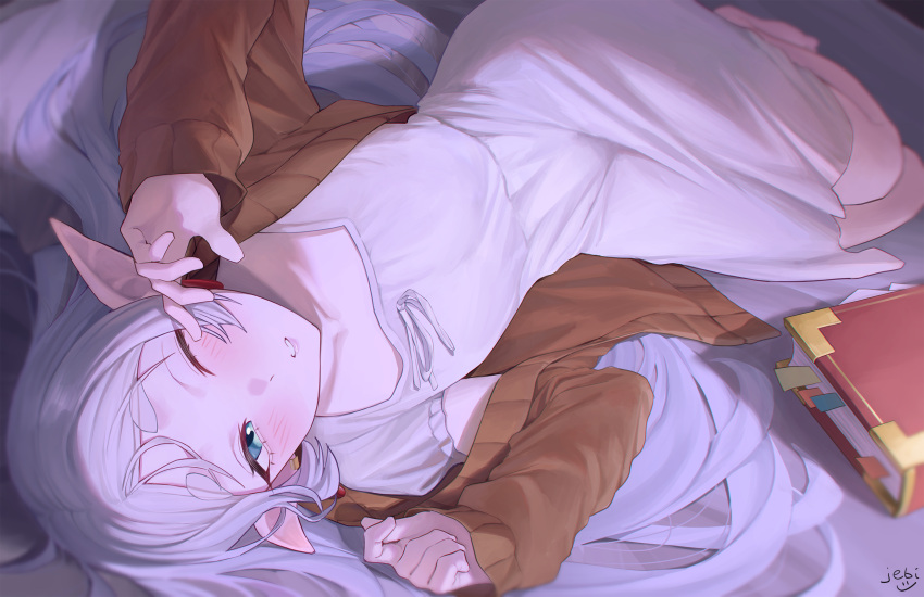 1girl aqua_eyes barefoot bed blurry book bookmark brown_jacket commentary_request depth_of_field dress elf frieren from_above highres jacket jebi long_hair looking_at_viewer lying on_bed on_side one_eye_closed open_clothes open_jacket parted_bangs parted_lips pointy_ears ribbon shirt sidelocks solo sousou_no_frieren thick_eyebrows waking_up white_dress white_hair white_ribbon