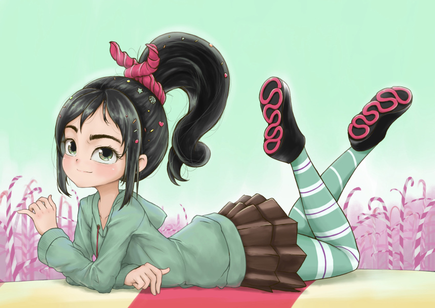 1girl absurdres black_hair candy candy_cane commentary disney feet_up food full_body green_eyes green_hoodie high_ponytail highres hood hoodie lolipop_(user_prtf2488) lying miniskirt on_stomach pleated_skirt ponytail raised_eyebrow shoes skirt solo star_(symbol) striped striped_thighhighs the_pose thigh-highs vanellope_von_schweetz wreck-it_ralph