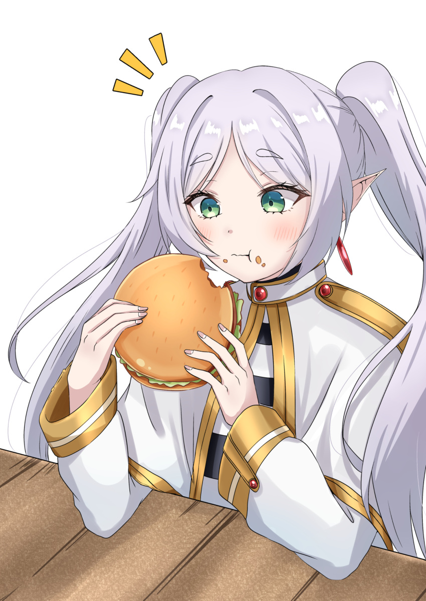 1girl blush burger capelet commentary dress earrings eating elf food frieren green_eyes highres holding holding_food jewelry long_hair pointy_ears simple_background solo sousou_no_frieren suzuka_(suzukawu) table thick_eyebrows twintails white_background white_capelet white_dress white_hair