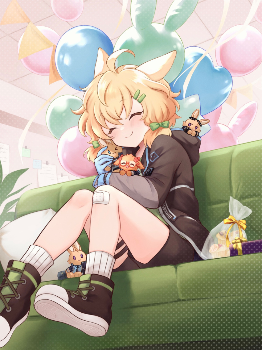 1girl ahoge animal_ears arknights balloon bandaid bandaid_on_knee bandaid_on_leg blonde_hair blue_gloves blush boots bow brown_shorts ceiling closed_eyes closed_mouth commentary_request couch cushion from_below gloves green_bow green_shirt hair_bow hair_ornament hairclip highres holding hood hood_down hooded_jacket indoors jacket knees kroos_(arknights) long_sleeves open_clothes open_jacket ribbed_socks riku_(kanitotora) shirt shorts sitting smile socks thigh_strap