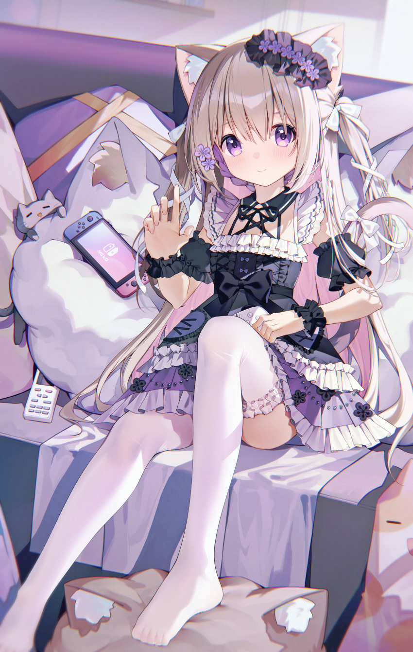 1girl absurdres animal_ear_fluff animal_ears black_bow black_dress bow cat_ears cat_girl cat_tail controller couch detached_sleeves dress hair_ornament highres light_brown_hair nintendo_switch on_couch original pillow ratto_(ratto_channel) remote_control sitting tail thigh-highs violet_eyes white_thighhighs wrist_cuffs