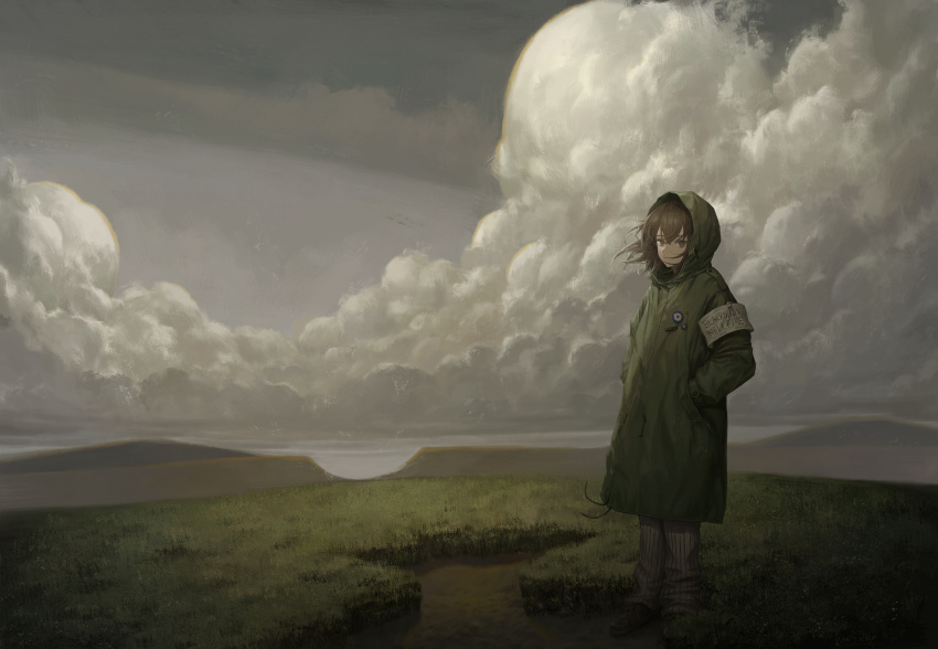 1girl absurdres armband badge brown_eyes brown_hair button_badge clouds coat commentary_request english_text full_body grass green_coat grey_sky hands_in_pockets highres hood hood_up hooded_coat long_sleeves looking_at_viewer medium_hair mountain original outdoors scenery sky solo standing subfiction